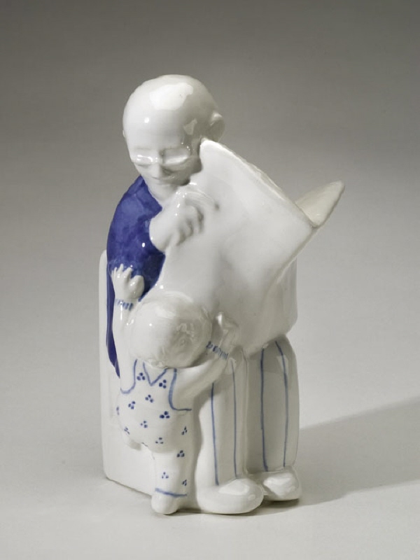 Figurin, äldre sittande man med barn
