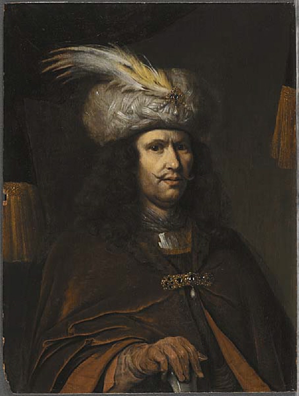 Man wearing turban with feathers