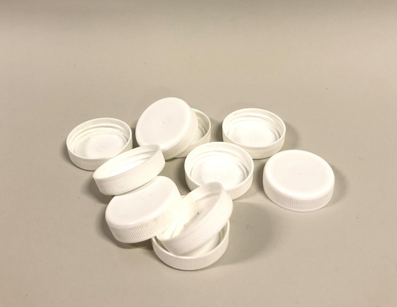 Skruvlock tillhörande returflaska för mjölk, vita (10 styck identiska)