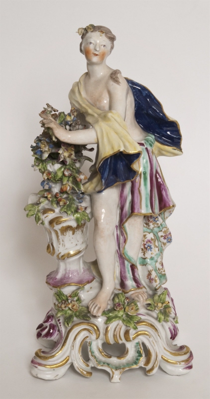 Figurin, stående nymf med blomsterurna