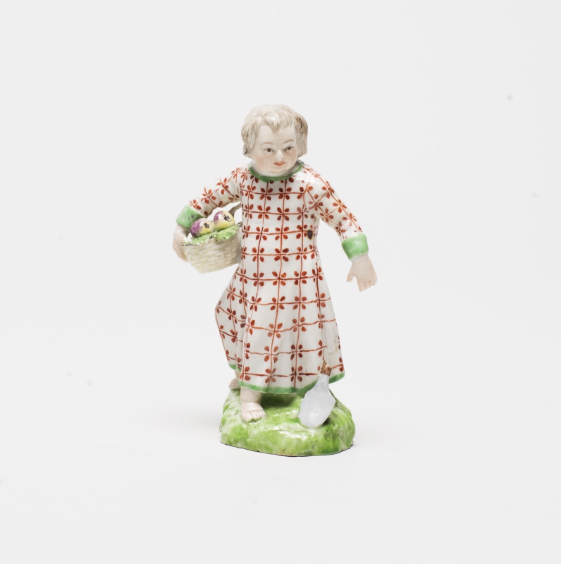 Figurin, flicka med fruktkorg och spade