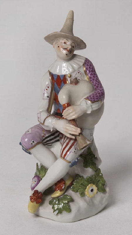 Figurine, ”Harlequin blowing bagpipes”