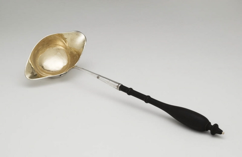 Sauce ladle with black wooden handle